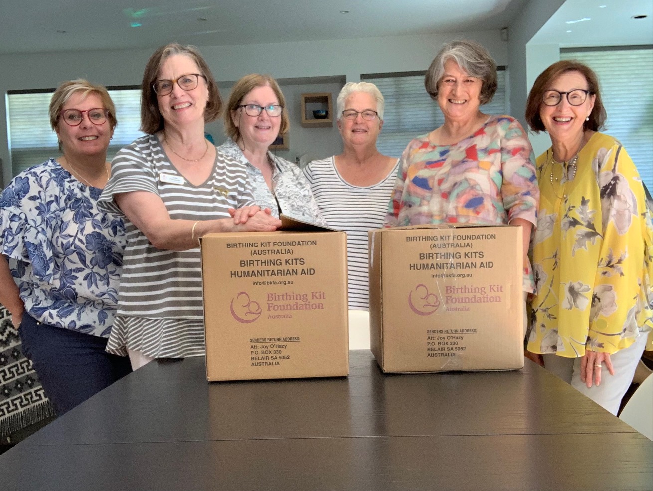 Zonta Club of Melbourne on Yarra volunteers assembling birthing kits