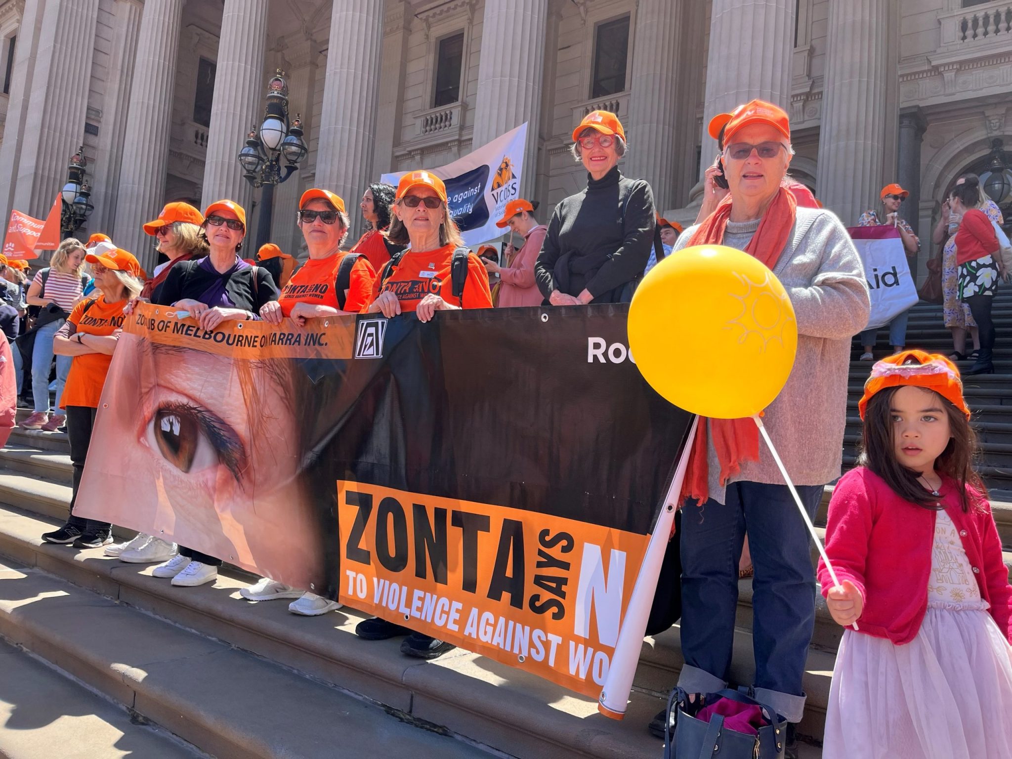Members marching with Zonta Says NO banners